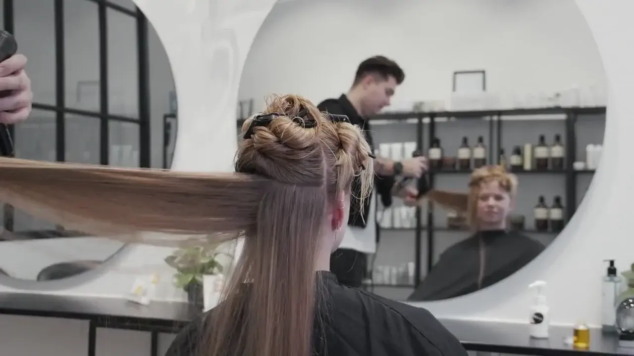 A stylist giving a smooth blow-dry