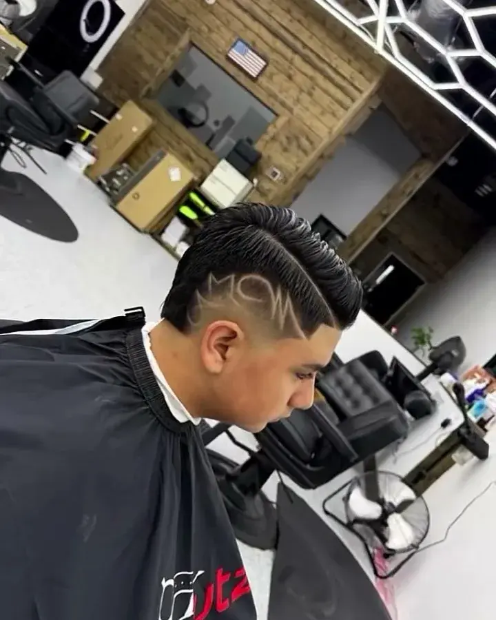 Fade with a freehand hair design, cut at EverCutz